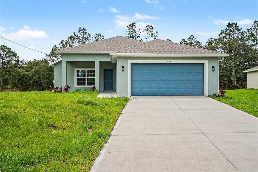Front exterior of a new home in , North Port, FL, highlighting curb appeal (Image 14). Front exterior of a new home in , North Port, FL, highlighting curb appeal (Image 14).