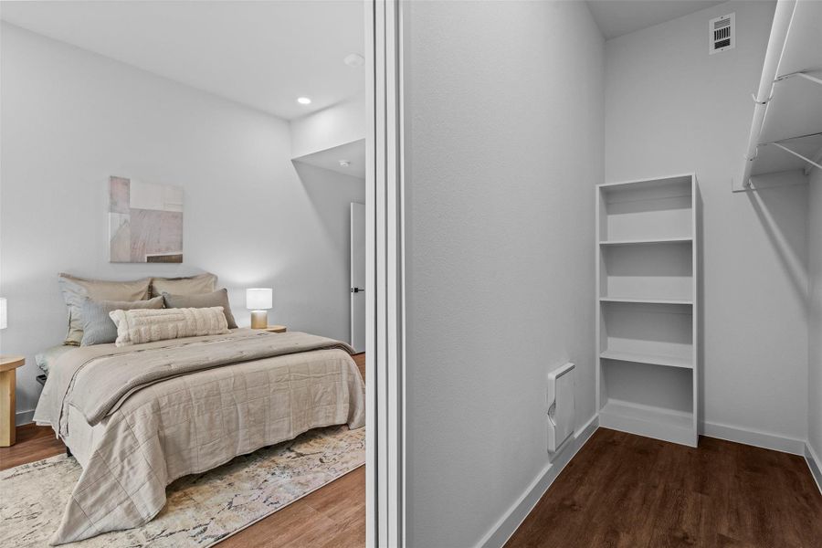 Bedroom featuring recessed lighting, visible vents, baseboards, and wood finished floors