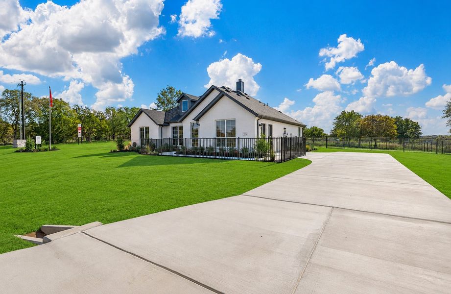Front exterior of a new home in Arbor Oaks, Boyd, TX, highlighting curb appeal (Image 2). Front exterior of a new home in Arbor Oaks, Boyd, TX, highlighting curb appeal (Image 2).