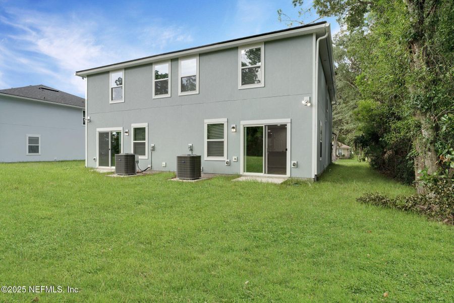 Front exterior of a new home in , Jacksonville, FL, highlighting curb appeal (Image 1).