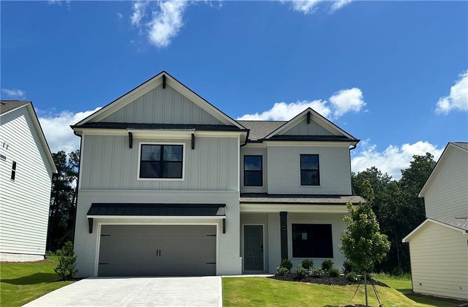Front exterior of a new home in Summerlin, Winder, GA, highlighting curb appeal (Image 21).