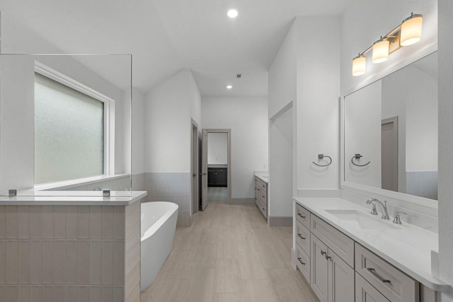 Additional view of the primary bathroom with seamless access to the laundry room! Additional view of the primary bathroom with seamless access to the laundry room!