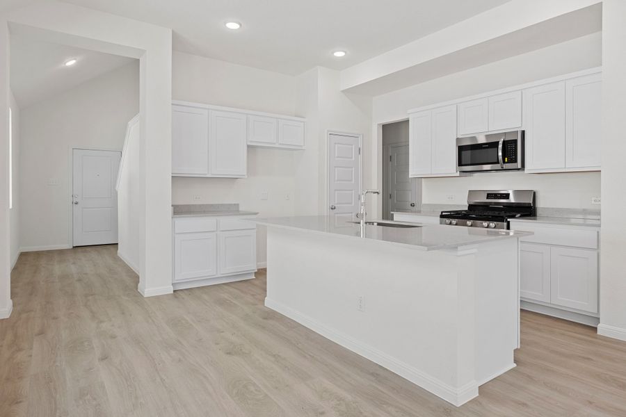 Kitchen in the Elm home plan by Trophy Signature Homes – REPRESENTATIVE PHOTO