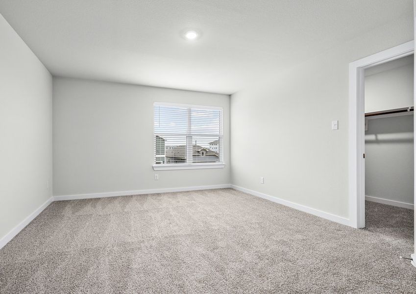 The master bedroom is spacious and has a large window. The master bedroom is spacious and has a large window.
