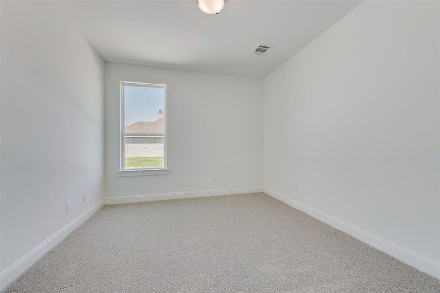 Unfurnished room with carpet