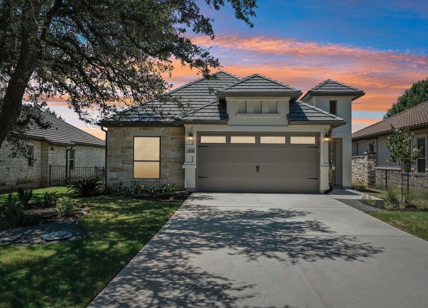 Front exterior of a new home in Cimarron Hills – Villas & Country Club, Georgetown, TX, highlighting curb appeal (Image 1).