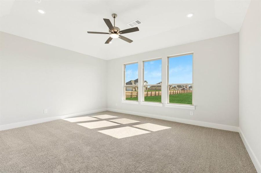 Spare room featuring light colored carpet, ceiling fan, and recessed lighting Spare room featuring light colored carpet, ceiling fan, and recessed lighting