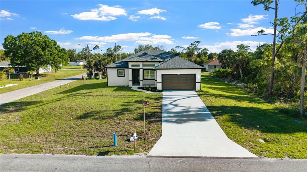 Front exterior of a new home in , Port Charlotte, FL, highlighting curb appeal (Image 2). Front exterior of a new home in , Port Charlotte, FL, highlighting curb appeal (Image 2).