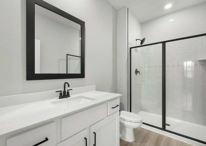 Master bathroom with a step-in shower that has tile detail Master bathroom with a step-in shower that has tile detail