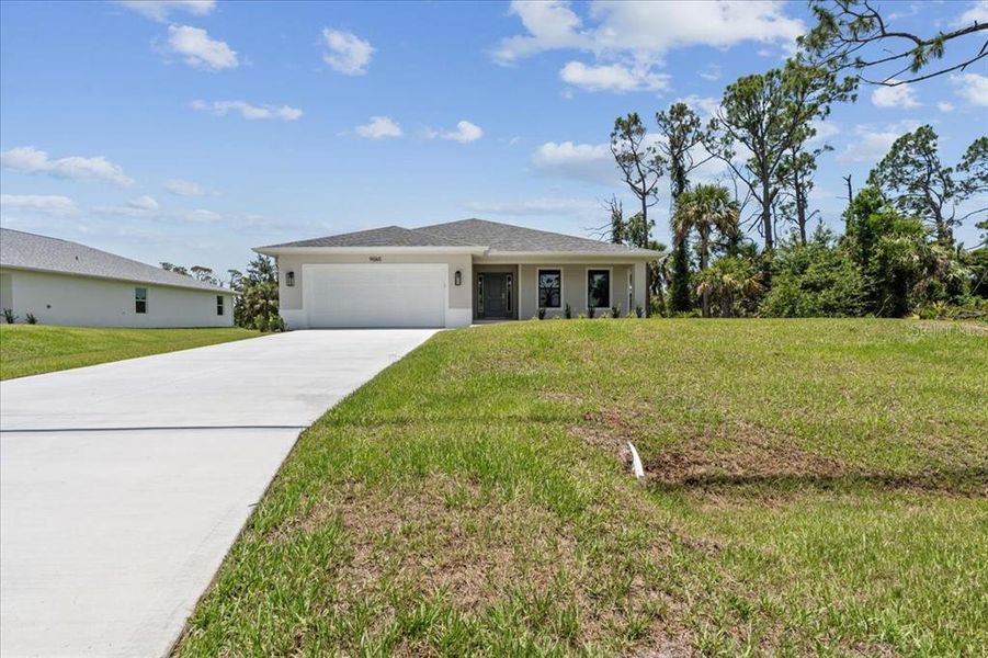 Front exterior of a new home in , Englewood, FL, highlighting curb appeal (Image 2). Front exterior of a new home in , Englewood, FL, highlighting curb appeal (Image 2).