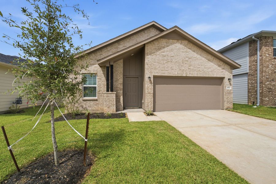 Front exterior of a new home in Bluestem, Brookshire, TX, highlighting curb appeal (Image 2).