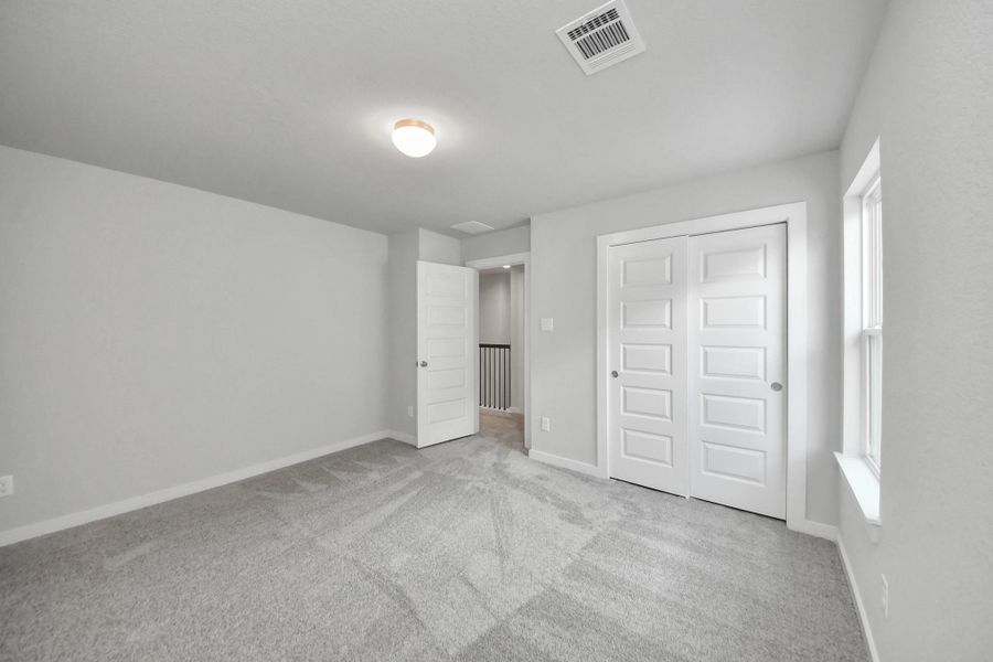 Generously sized secondary bedrooms, complete with spacious closets and soft, inviting carpeting. Enjoy abundant natural light streaming in through the large windows, complemented by privacy blinds for your personal sanctuary. Generously sized secondary bedrooms, complete with spacious closets and soft, inviting carpeting. Enjoy abundant natural light streaming in through the large windows, complemented by privacy blinds for your personal sanctuary.