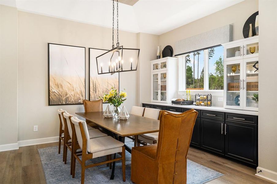 EXAMPLE PHOTO: Dining area offers built in cabinets