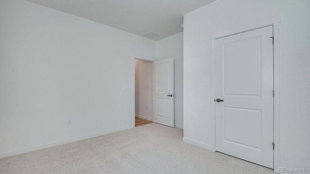 Spacious, unfurnished interior of a new home in Trails at Crowfoot, Parker (Image 32).