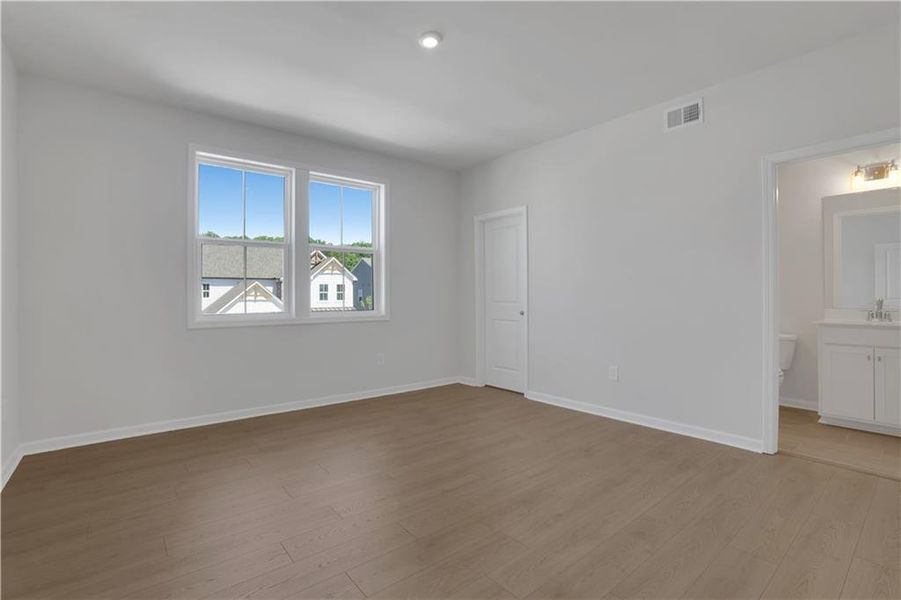 Spacious, unfurnished interior of a new home in The Paddocks at Doc Hughes, Buford (Image 41).