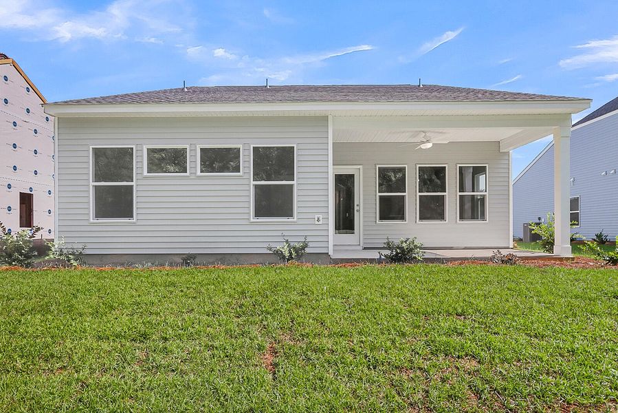 Exterior details and patio area of a home in Fairway Woods at Wyboo, Manning (Image 25).
