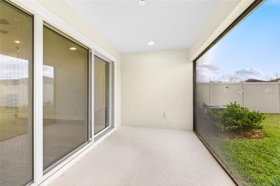 Exterior details and patio area of a home in Crosswind Point, Parrish (Image 25).