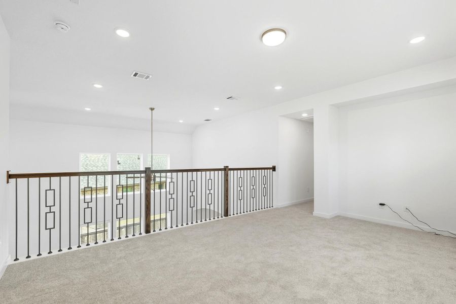 Loft overlooks the living room. Loft overlooks the living room.