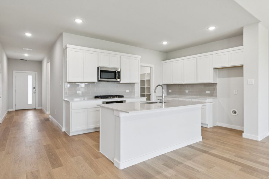 Kitchen in the Masters home plan by Trophy Signature Homes – REPRESENTATIVE PHOTO Kitchen in the Masters home plan by Trophy Signature Homes – REPRESENTATIVE PHOTO