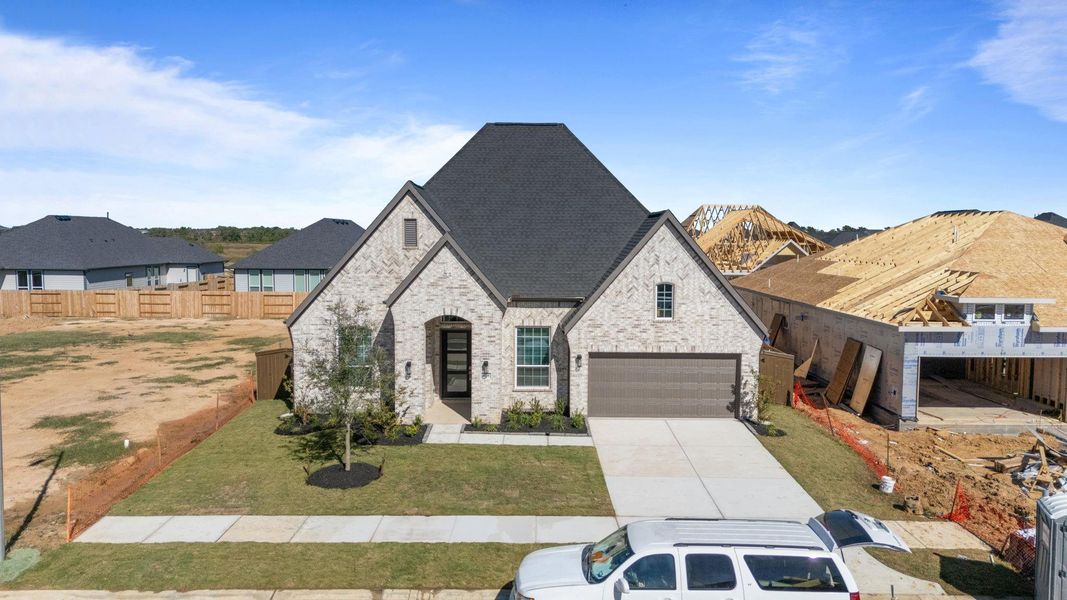 Front exterior of a new home in Attwater, Waller, TX, highlighting curb appeal (Image 20).