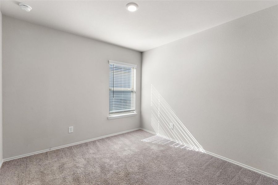 Secondary bedroom with carpet flooring. Secondary bedroom with carpet flooring.