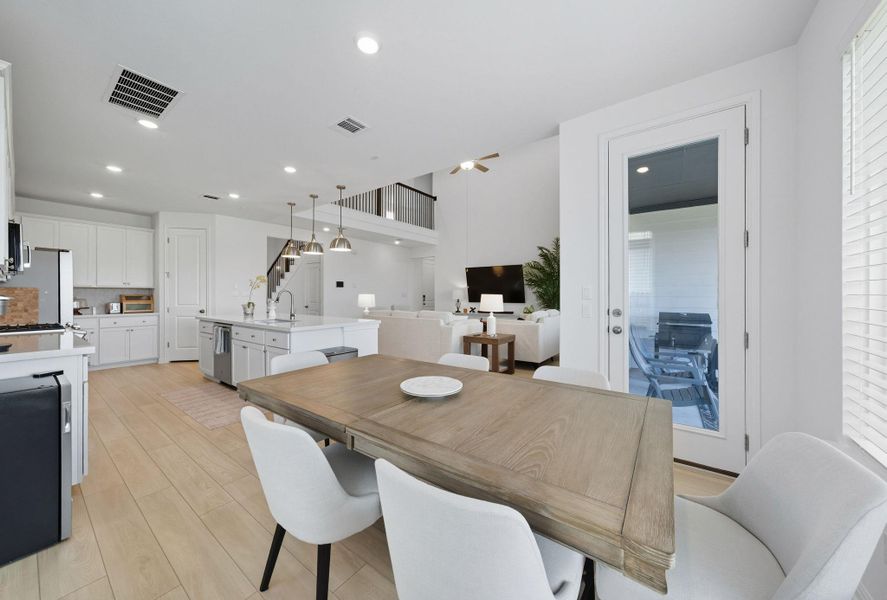 Dining area with light wood-style floors, plenty of natural light, and recessed lighting Dining area with light wood-style floors, plenty of natural light, and recessed lighting