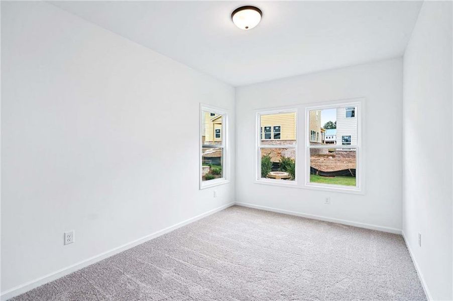 Spacious, unfurnished interior of a new home in Eastlyn Crossing, Flowery Branch (Image 19).