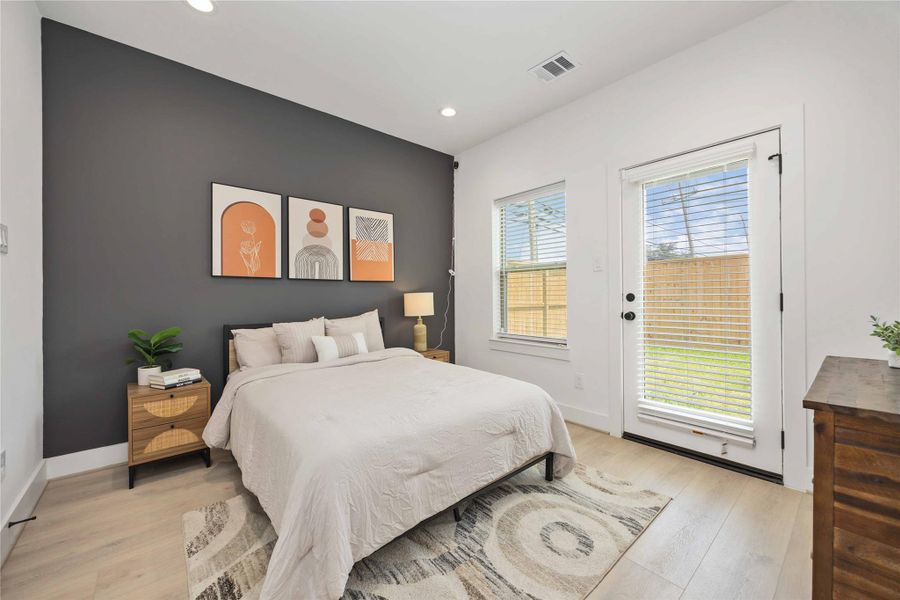 First floor secondary bedroom with full en-suite bath. Photo is from the model home. Finishes and specifications may vary.