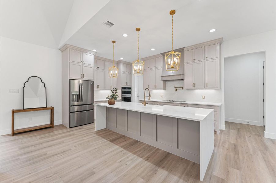 Plenty of cabinet space and a walk-in pantry make this space as functional as it is beautiful. Plenty of cabinet space and a walk-in pantry make this space as functional as it is beautiful.