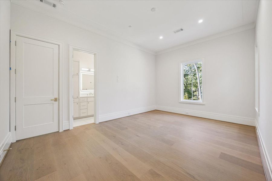 Bedroom #4 on the second floor. Has an en-suite bath with wak-in shower and a walk-in closet with custom built-ins.