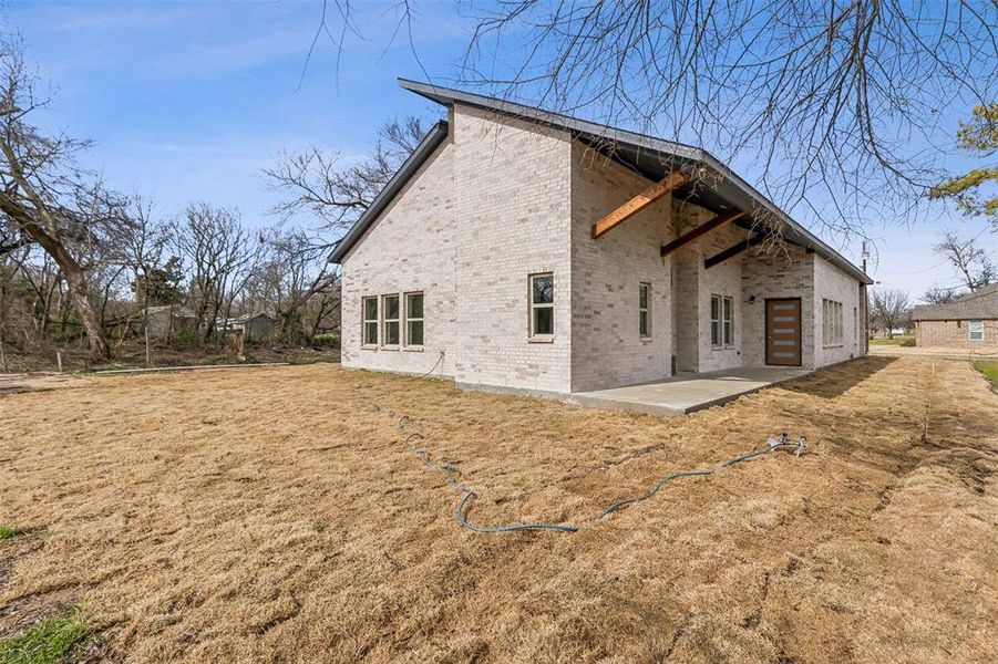 Rear view of property with a patio