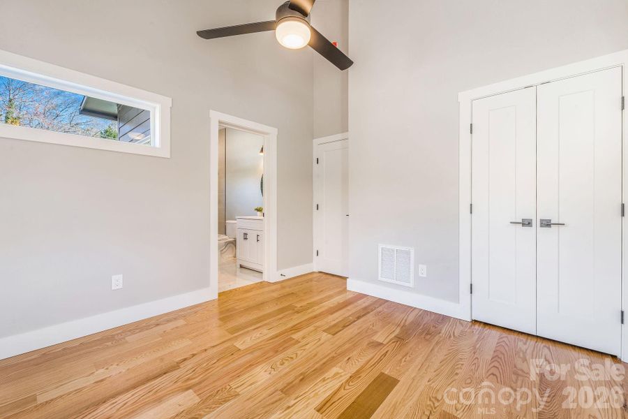 Secondary bedroom upstairs with vaulted ceilings