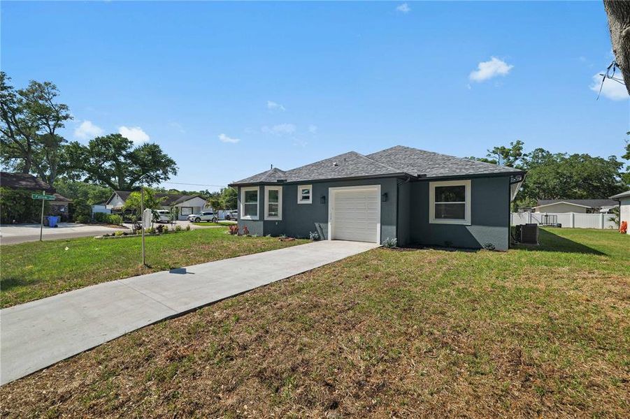 Front exterior of a new home in , Tampa, FL, highlighting curb appeal (Image 23).