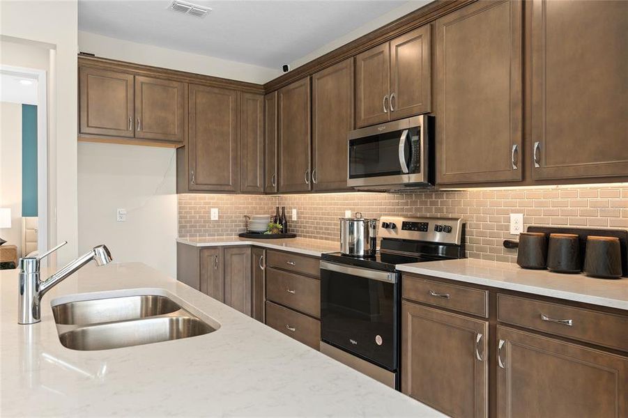 Furnished interior view inside a new home in Tohoqua, Kissimmee (Image 18).