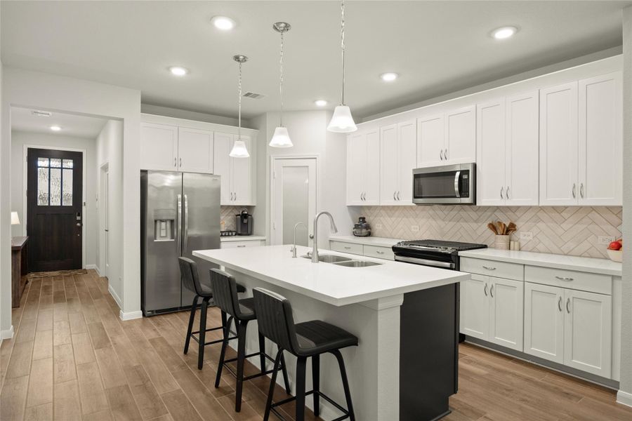 The kitchen is perfectly positioned to overlook both the dining and living areas. The kitchen is perfectly positioned to overlook both the dining and living areas.