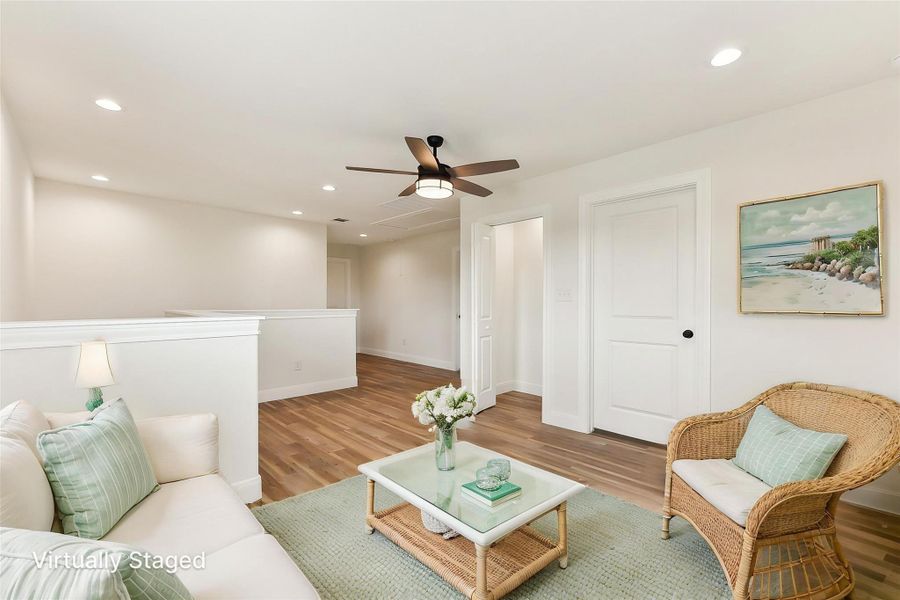 Virtually Staged Upstairs Family Area featuring baseboards, recessed lighting, and light wood-style floors Virtually Staged Upstairs Family Area featuring baseboards, recessed lighting, and light wood-style floors