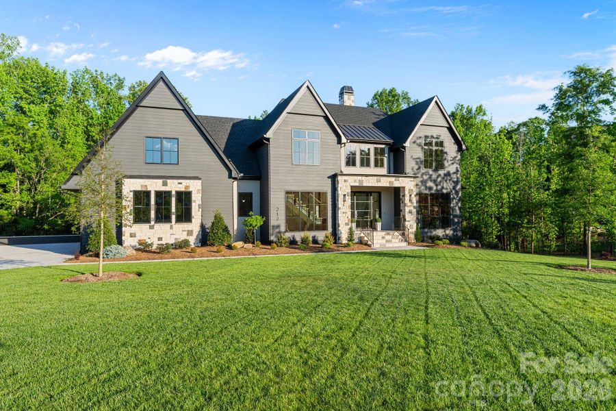 Front exterior of a new home in Cardinal Crest, Weddington, NC, highlighting curb appeal (Image 2). Front exterior of a new home in Cardinal Crest, Weddington, NC, highlighting curb appeal (Image 2).