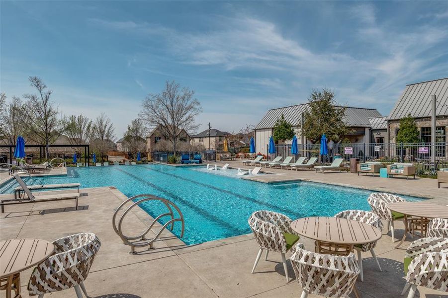 Community pool with a patio