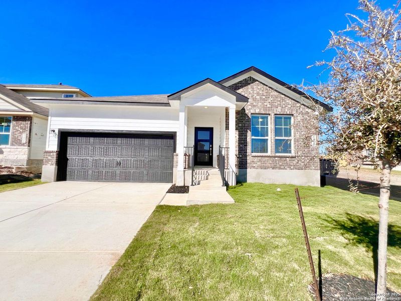 Front exterior of a new home in Horizon Pointe, Converse, TX, highlighting curb appeal (Image 2). Front exterior of a new home in Horizon Pointe, Converse, TX, highlighting curb appeal (Image 2).