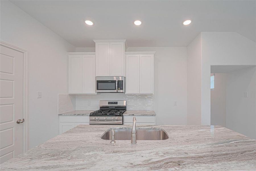 Furnished interior view inside a new home in Sunterra, Katy (Image 8).