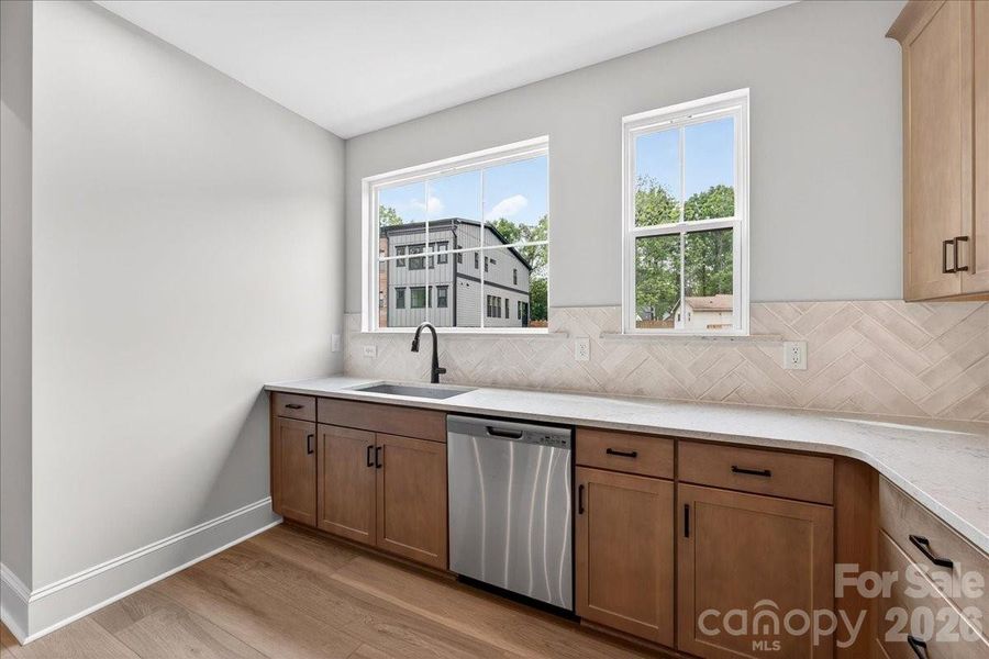 Large single bowl stainless steel sink facing outside