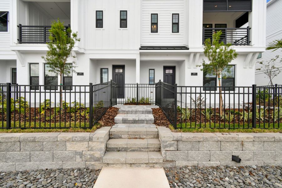 Exterior details and patio area of a home in Emerald Landing at Waterside at Lakewood Ranch – City Homes, Sarasota (Image 30).