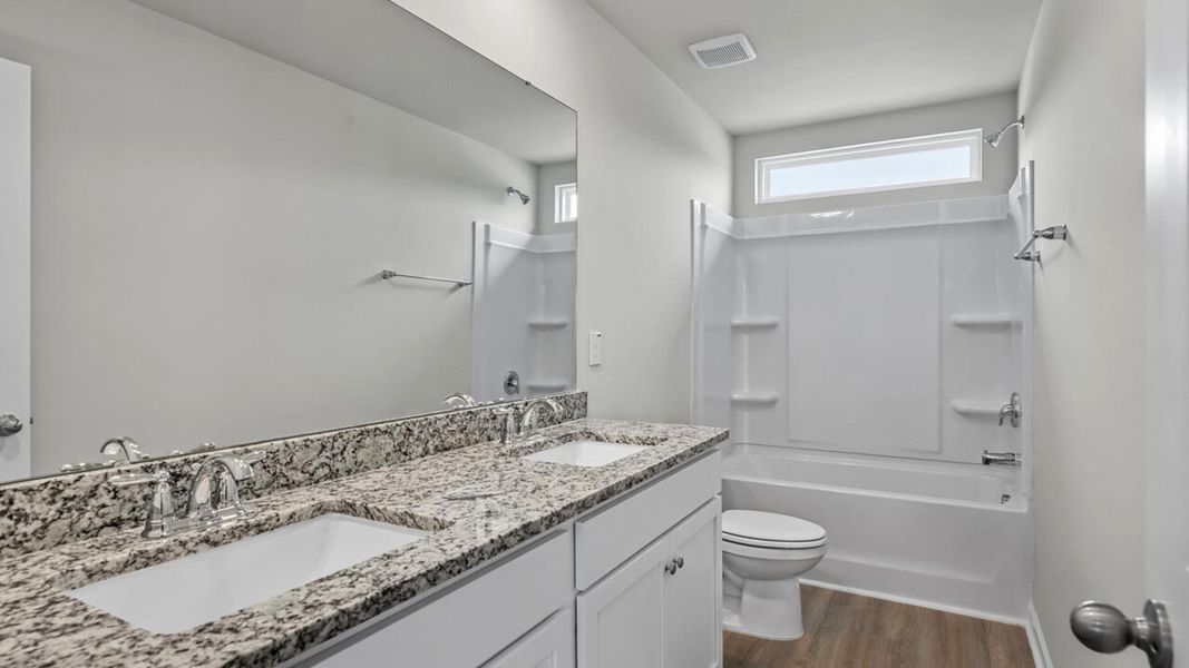 Furnished interior view inside a new home in Surfside Landing, Hubert (Image 14).