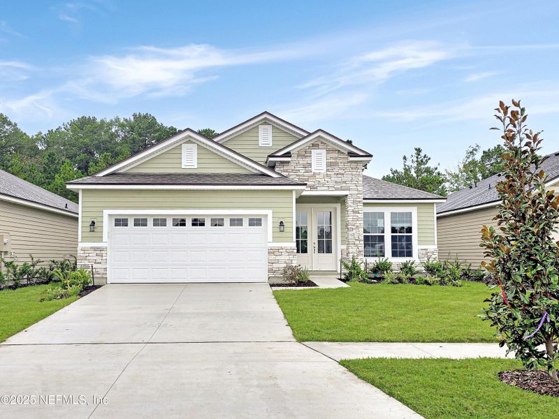 Front exterior of a new home in Hyland Trail, Green Cove Springs, FL, highlighting curb appeal (Image 1). Front exterior of a new home in Hyland Trail, Green Cove Springs, FL, highlighting curb appeal (Image 1).