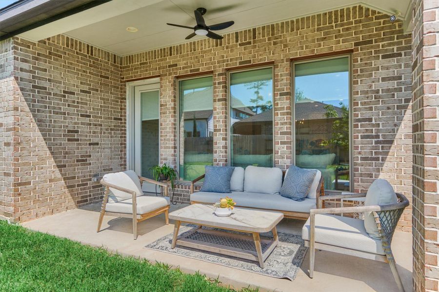 Outdoor ceiling fan (2023) and covered patio.