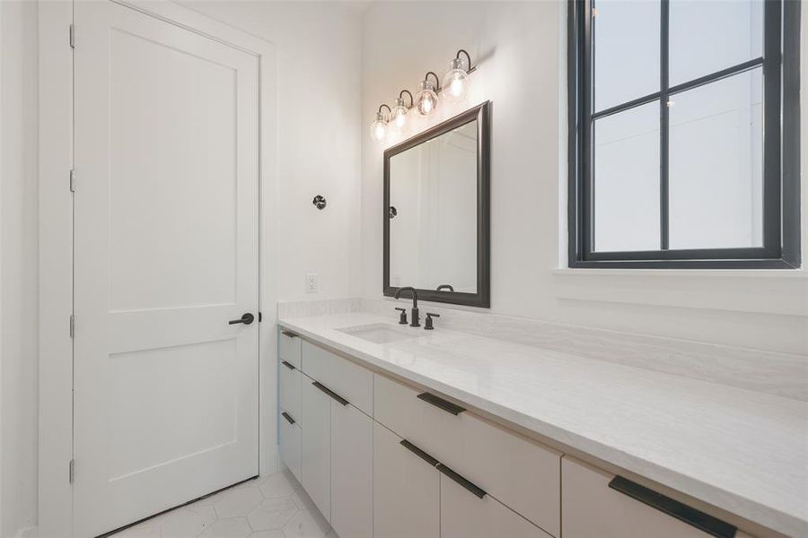 Another secondary bath showing the attention to quality details in each room of this home.