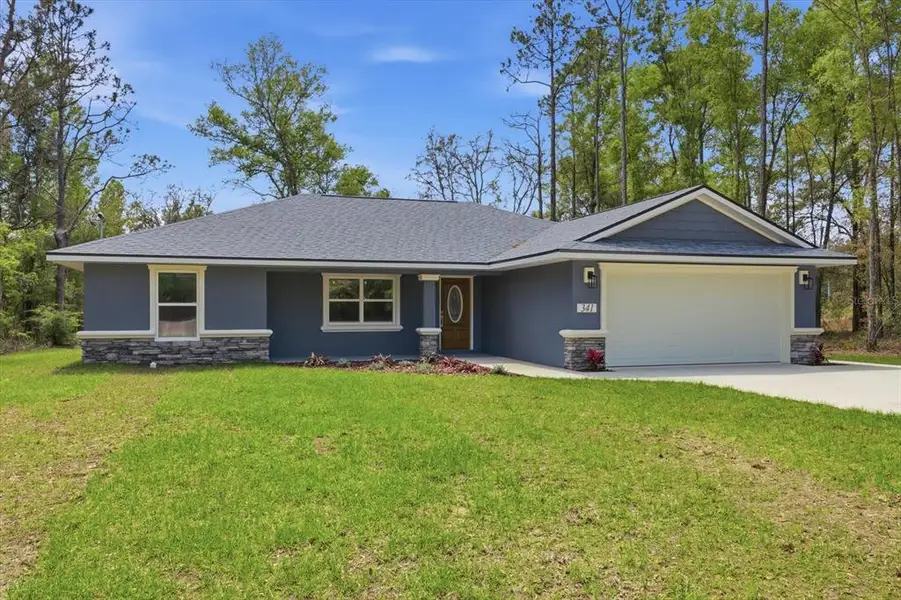 Front exterior of a new home in , Dunnellon, FL, highlighting curb appeal (Image 1). Front exterior of a new home in , Dunnellon, FL, highlighting curb appeal (Image 1).