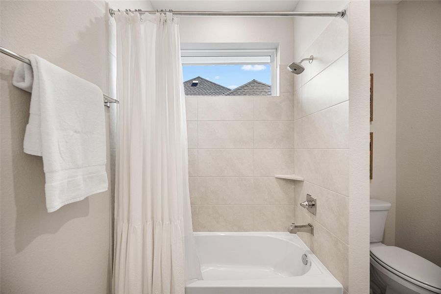 Furnished interior view inside a new home in Woodson’s Reserve, Spring (Image 39).