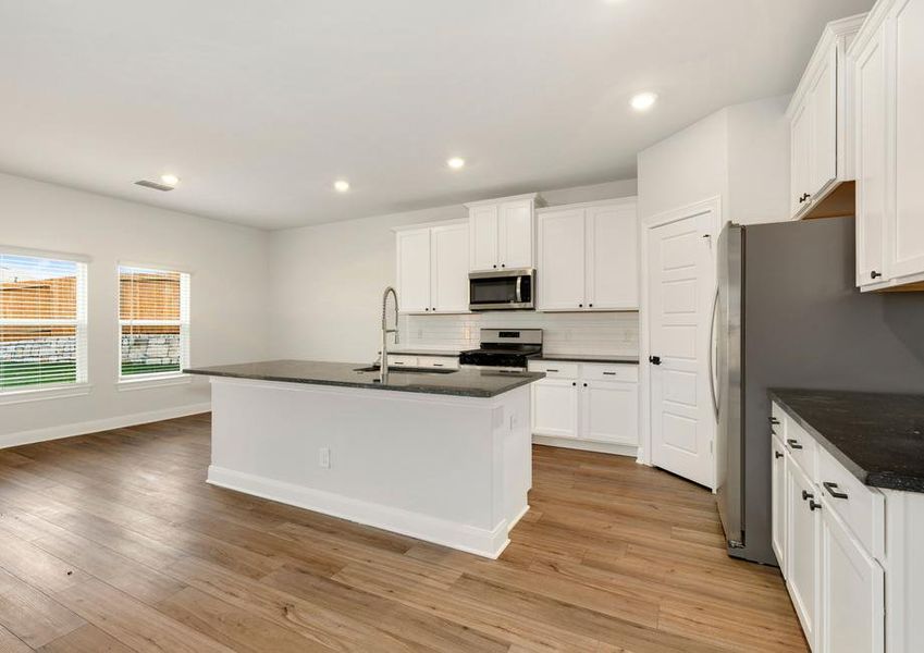 Upgraded kitchen with an oversized island and sprawling countertops.