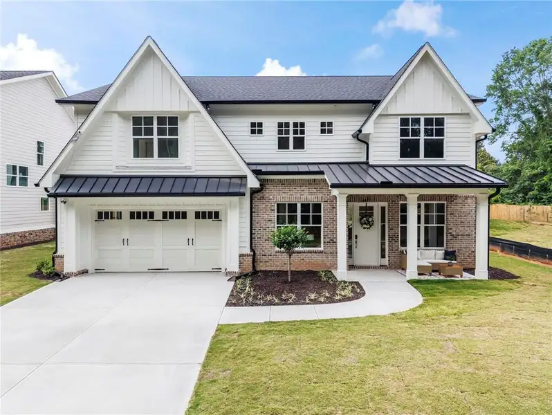 Front exterior of a new home in , Marietta, GA, highlighting curb appeal (Image 2). Front exterior of a new home in , Marietta, GA, highlighting curb appeal (Image 2).
